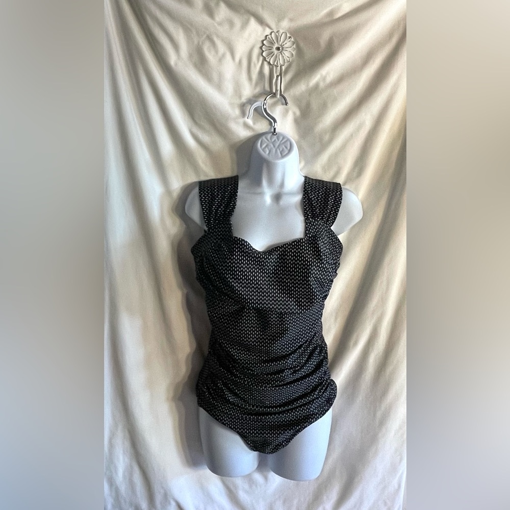 Albion Brand. One piece swimsuit excellent support.SZ M. Never wore.